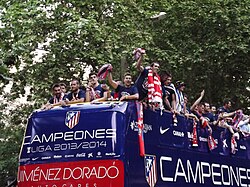 Atlético Madrid celebrates after winning the 2013–14 La Liga. Simeone can be seen in the back of the photo.
