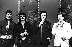 Lewis performing with Roy Orbison, Johnny Cash, and Carl Perkins on The Johnny Cash Christmas Special in November 1977