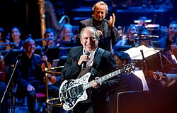 Hans Zimmer (composer of the 2021 film No Time to Die) with the Royal Philharmonic Orchestra at the Royal Albert Hall in London in 2022 during The Sound of 007 in Concert to mark 60 years of the Bond series.