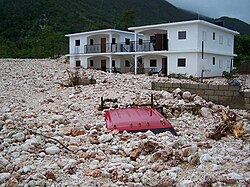 A truck buried under rubble in Haiti