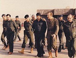 Adnan Khairallah, Iraqi Defence Minister, meeting with Iraqi soldiers during the war