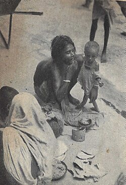 A destitute mother and child on the pavement in Calcutta during the Bengal famine of 1943.