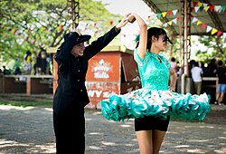 In Colombia's joropo dance, female dancers wear short skirts with brightly colored prints and lace.
