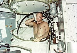 Astronaut Jack R. Lousma taking a shower in space, 1973