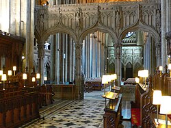 The choir of Bristol Cathedral, with the nave seen through the chancel screen, so looking west