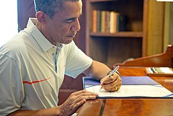 President Obama signing the Bipartisan Budget Act of 2013 on December 26, 2013