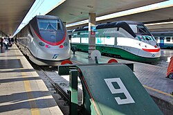 A pair of Italian FS' ETR 500 at Firenze Santa Maria Novella railway station. The version ETR 500 Y1 achieved 362 km/h (225 mph) on the Bologna-Florence line on 4 February 2009, a new world speed record in a tunnel.[6]