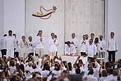 Former President Juan Manuel Santos signing a peace accord