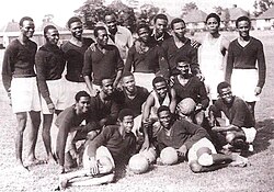 The Nigeria "UK Tourists" national team prior to their tour of the UK in 1949. The team were known among the West African nations at the time as the "Red Devils" due to their red shirts.
