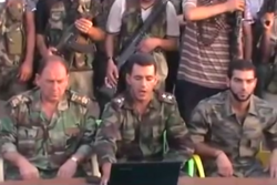 A colonel (left) and a first lieutenant (right) in the FSA announce the formation of the Conquest Brigade, part of the FSA in Tell Rifaat, north of Aleppo, 31 July 2012.