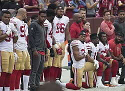 NFL players taking the knee prior to a game in October 2017