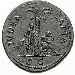A Roman coin inscribed Ivdaea Capta, or "captive Judea" (71 CE), representing Judea as a seated mourning woman (right), and a Jewish captive with hands tied (left)