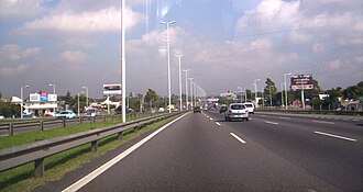 The 22nd kilometre of National Route 7, in Partido de Morón, Buenos Aires. In this section is a freeway with four lanes in each side.