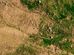 Haiti's border with the Dominican Republic in 2002, showing the extent of deforestation on the Haitian side (left)