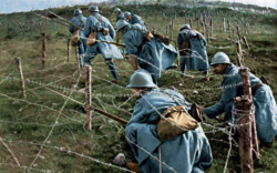 French infantry pushing through enemy barbed wire, 1915