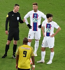 Ramos (centre, in white) playing for Paris Saint-Germain in 2023