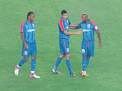 Drogba (left) playing for Shanghai Shenhua in July 2012