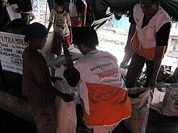Emergency food distribution in a disaster area in Indonesia by World Vision International, in 2009