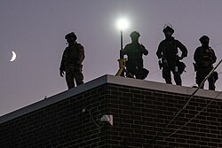 ICE agents on top of the Broadview ICE Detention Center on September 9, 2025