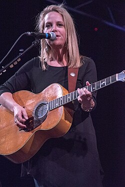 Singer Mary Chapin Carpenter performing while playing a guitar
