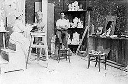 Mora working at her studio in 1903