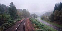 Highland Main Line and A9 highway next to each other in Perthshire, September 2000