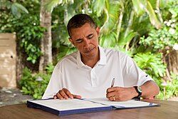 Hawaii-born President Barack Obama signs the Zadroga Act in Kailua, Hawaii