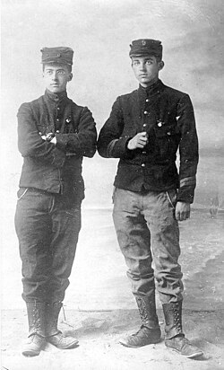 Georges Lemaître (left) and his younger brother Jacques (right) in uniform after they volunteered for the Belgian Army on 7 August 1914