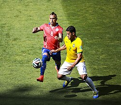 Chile playing against Brazil in the 2014 FIFA World Cup Round of 16. Arturo Vidal and Hulk in front