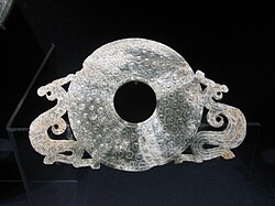 Bi jade-disk with a dual dragon motif, Warring States period.