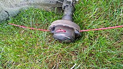 A fixed line style string trimmer head