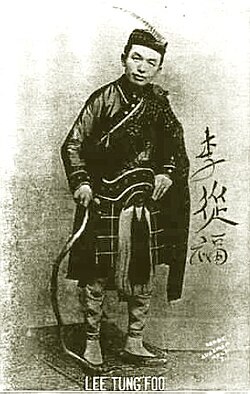 Chinese-American Vaudeville comedian Lee Tung Foo, dressed in a Scottish kilt