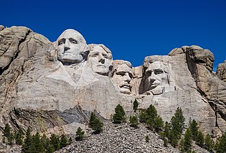 Washington and other figures engraved into the side of a mountain