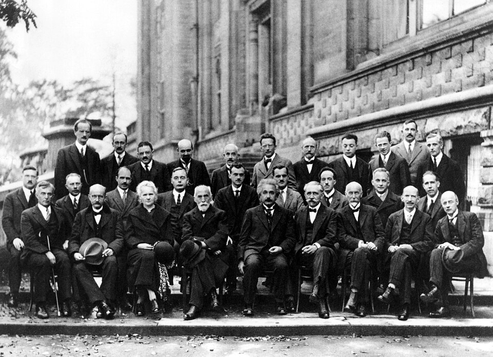 A. Piccard, E. Henriot, P. Ehrenfest, E. Herzen, Th. De Donder, E. Schrödinger, J.E. Verschaffelt, W. Pauli, W. Heisenberg, R.H. Fowler, L. Brillouin;P. Debye, M. Knudsen, W.L. Bragg, H.A. Kramers, P.A.M. Dirac, A.H. Compton, L. de Broglie, M. Born, N. Bohr;I. Langmuir, M. Planck, M. Skłodowska-Curie, H.A. Lorentz, A. Einstein, P. Langevin, Ch. E. Guye, C.T.R. Wilson, O.W. RichardsonFifth conference participants, 1927. Institut International de Physique Solvay in Leopold Park.(vte) Image