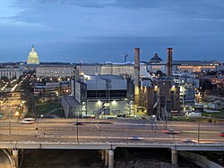 The plant and I-695 at dusk