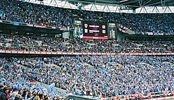 Portsmouth fans celebrate winning the FA Cup against Cardiff City in 2008. The 89,874 attendance is the largest football attendance in the new Wembley's history.[93]