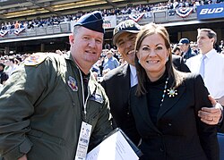 A New York Air National Guard major poses with Rudy and Judith Giuliani at the new Yankee Stadium in April 2009