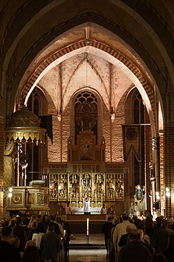 The eastwards-facing choir of Strängnäs Cathedral, Sweden, during the Easter Vigil.