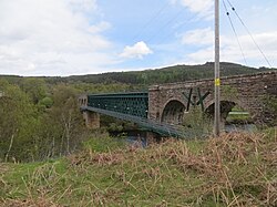 Invershin Viaduct over the Kyle of Sutherland; the public footpath across the Kyle can be seen immediately adjacent to the viaduct.