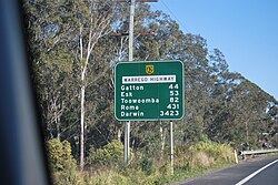 A route confirmation sign on the Warrego Highway in Queensland, Australia, informing motorists of their distance (in kilometres) from the places listed