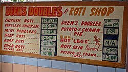 Many restaurants serve Trinidad and Tobago dishes such as Roti or doubles. Fresh cut coconut water and jelly is another popular item.