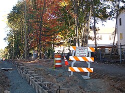 A road sign in Yiddish (except for the word "sidewalk") at an official construction site in the Monsey hamlet, a community with thousands of Yiddish speakers, in Ramapo, New York
