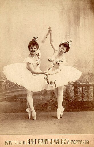 Pierina Legnani (left) as Medora and Olga Preobrajenska (right) as Gulnare in the scene Le jardin animé from Marius Petipa's final revival of Le Corsaire, St. Petersburg, 1899. Legnani was named première danseuse assoluta of the Teatro alla Scala in Milan, and would later be named prima ballerina assoluta of the St. Petersburg Imperial Theatres. Preobrajenska became prima ballerina of the St. Petersburg Imperial Theatres and went on to become one of the most influential teachers in the history of classical ballet.