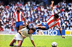 Cruz and Cabañas going for the ball in Mexico v Paraguay