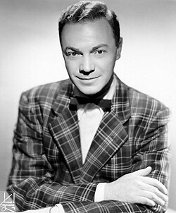 Disc jockey Alan Freed is credited with popularizing the term "rock and roll" and introducing the genre across racial barriers in the 1950s