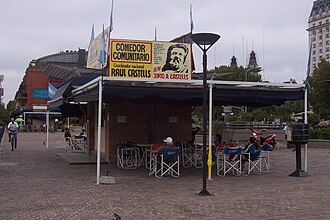 Raúl Castells exhorts passersby from a billboard above his Puerto Madero dinette.