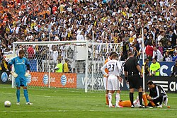 Calen Carr lies injured as David Beckham looks on during the 2012 MLS Cup