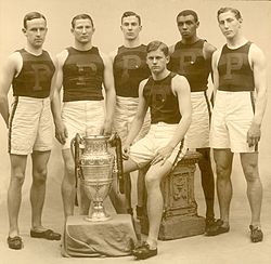 The University of Pennsylvania men's track team was the 1907 IC4A point winner. Left to right: Guy Haskins, R.C. Folwell, T.R. Moffitt, John Baxter Taylor, Jr., the first Black athlete in the U.S. to win a gold medal in the Olympics,[86] Nathaniel Cartmell, and J.D. Whitham (seated)