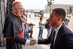 Hazard shaking hands with Cardinal Carlos Osoro Sierra in 2022