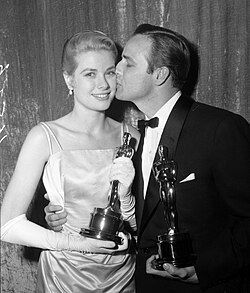 Kelly with Marlon Brando at the 27th Academy Awards in 1955